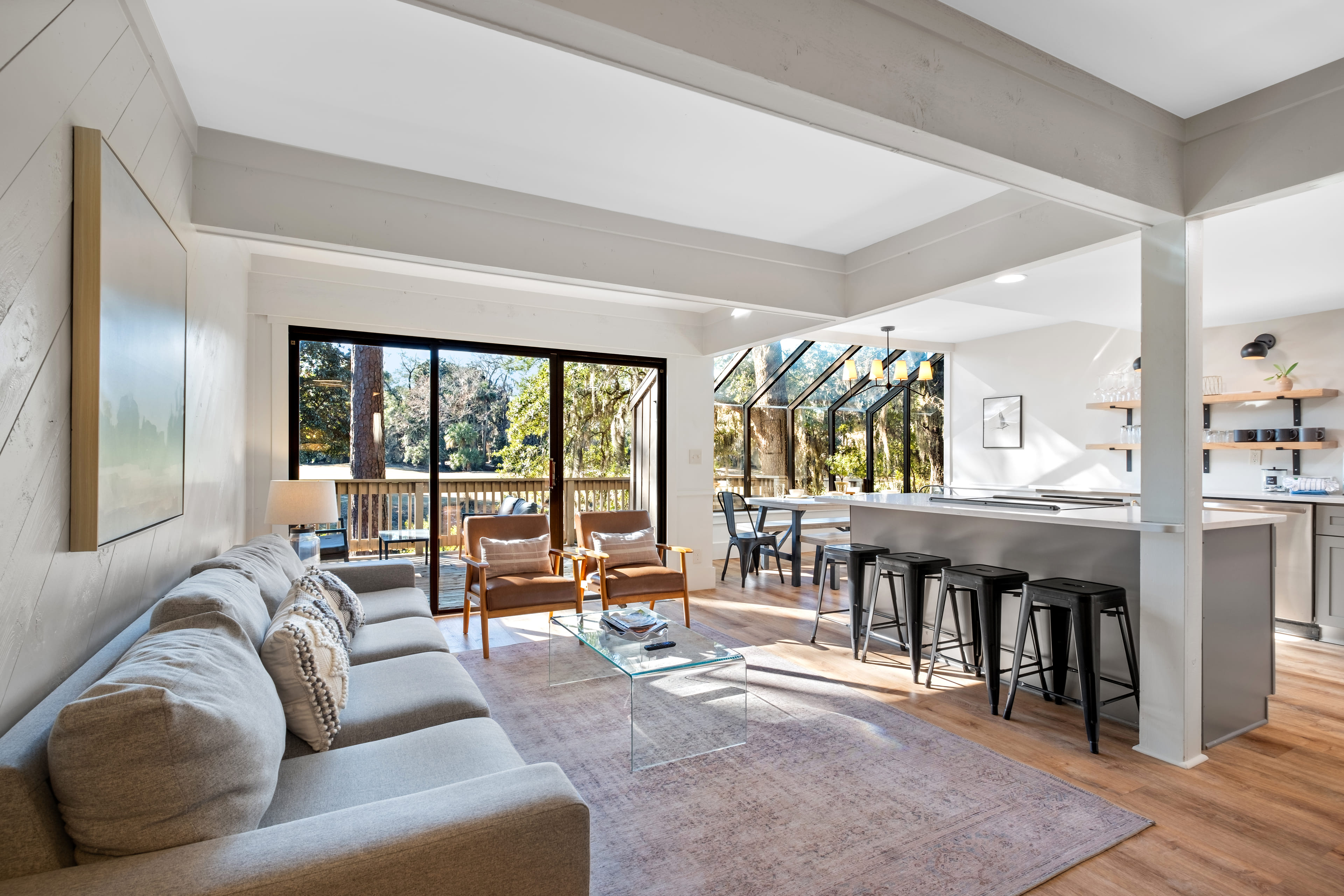 Bright open concept space with kitchen island and glass ceiling dining area